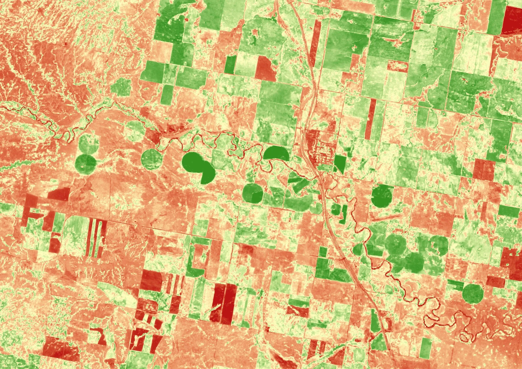 Sentinel-2 NDVI image from 2016 of farmland along the Milk River in Alberta, with healthy vegetation in green and sparse vegetation in red.