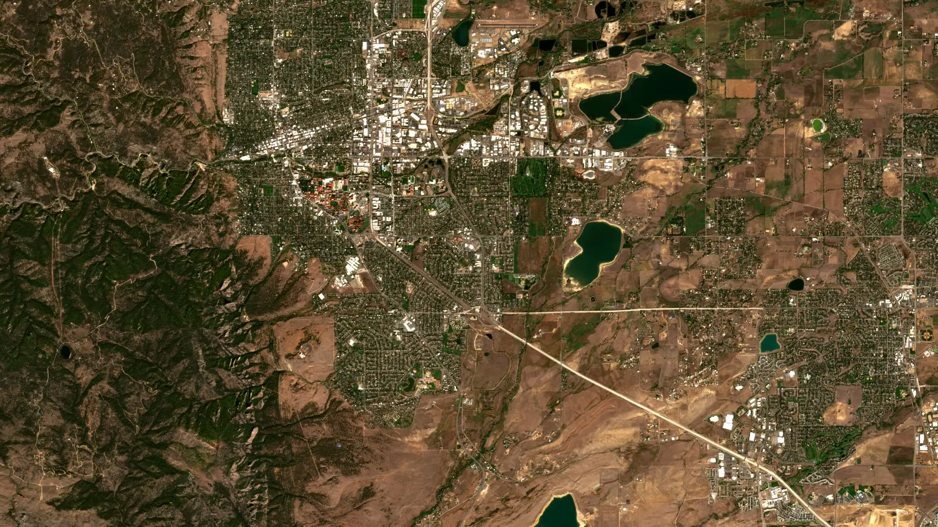 Sentinel-2 image of Boulder, Colorado, where the forested foothills of the Rocky Mountains meet the city, its reservoirs and the dry plains to the east. Boulder and the Front Range, Colorado, 2 October 2026