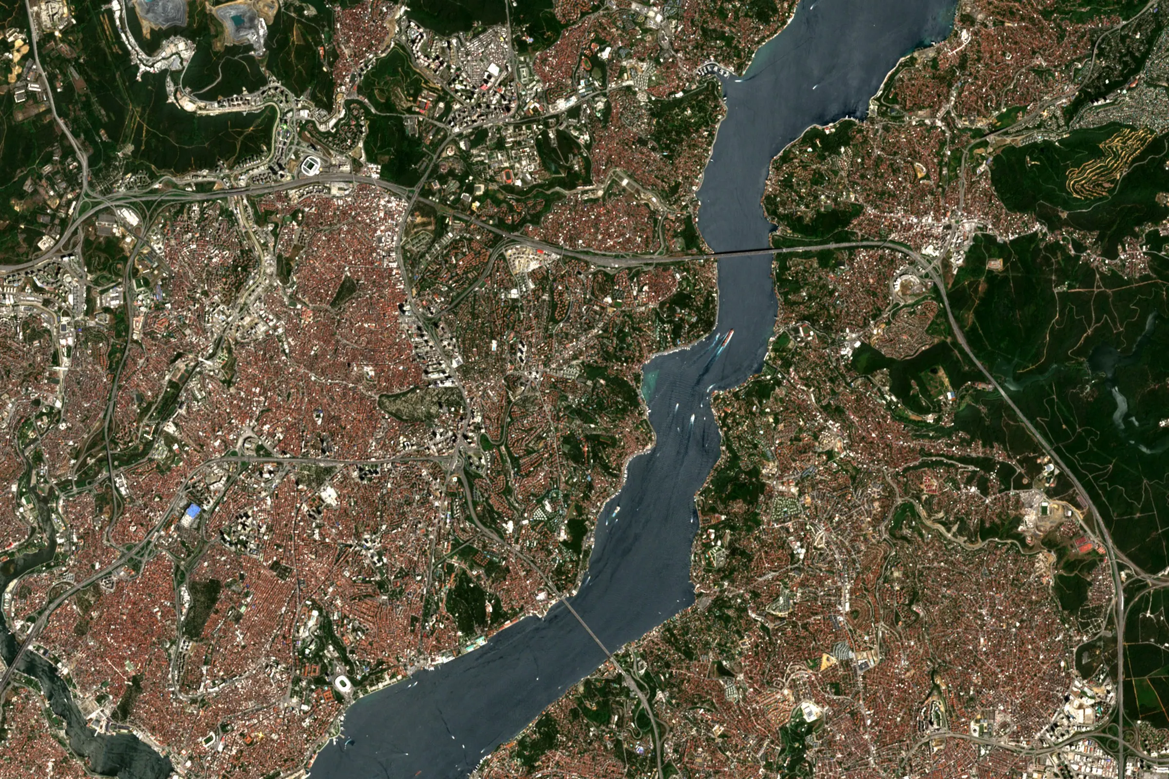 Satellite view of the Bosphorus at Istanbul, with ships in the strait between the European and Asian shores and two bridges crossing it